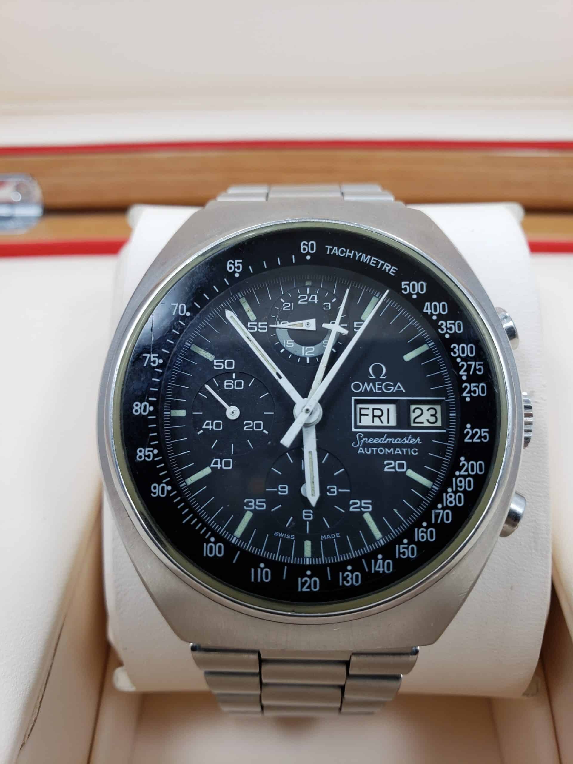 Omega Speedmaster Automatic chronograph with black dial, day-date and steel bracelet